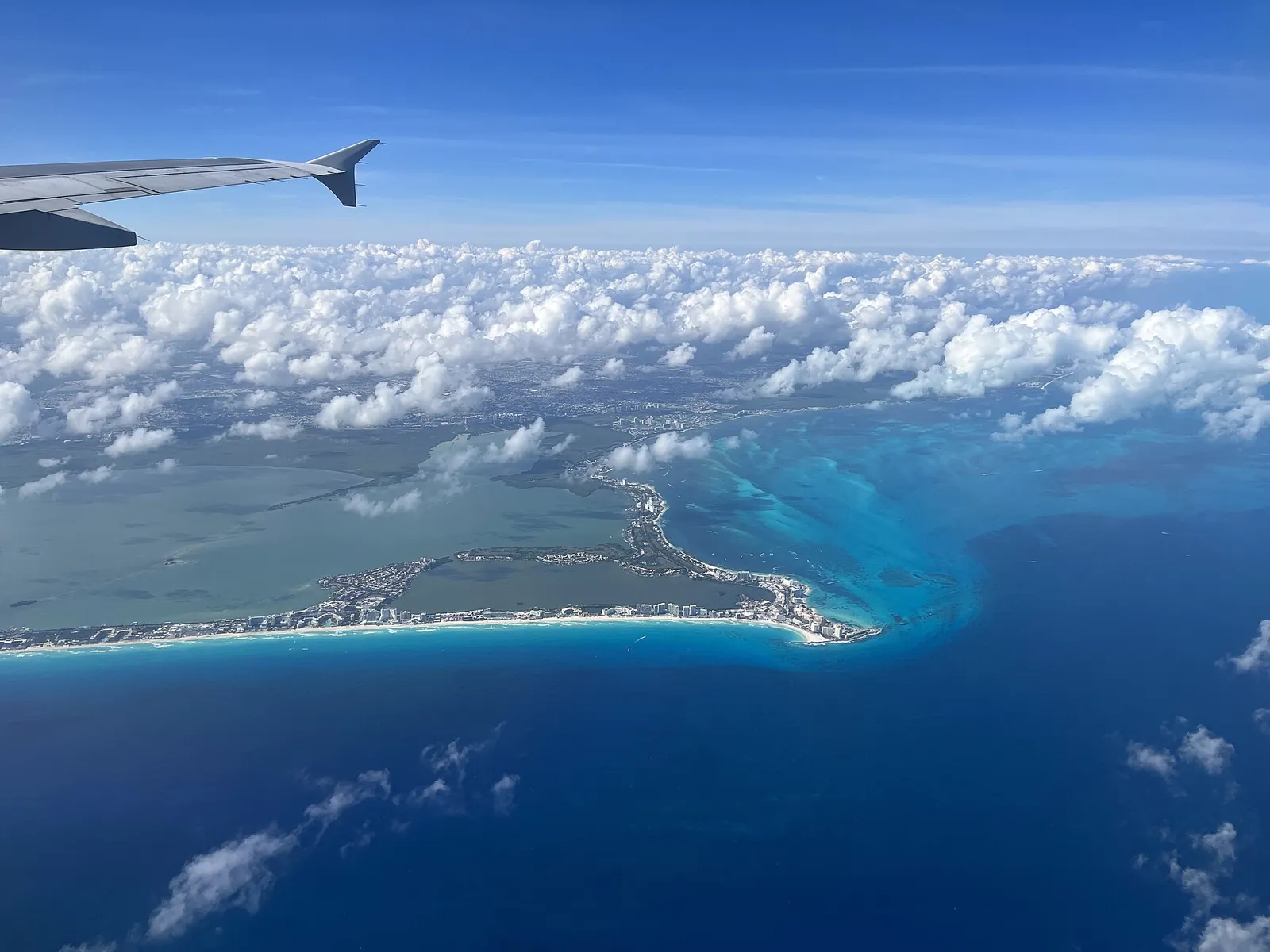Cancun's coast, hotel strip and lagoon seen from the air.