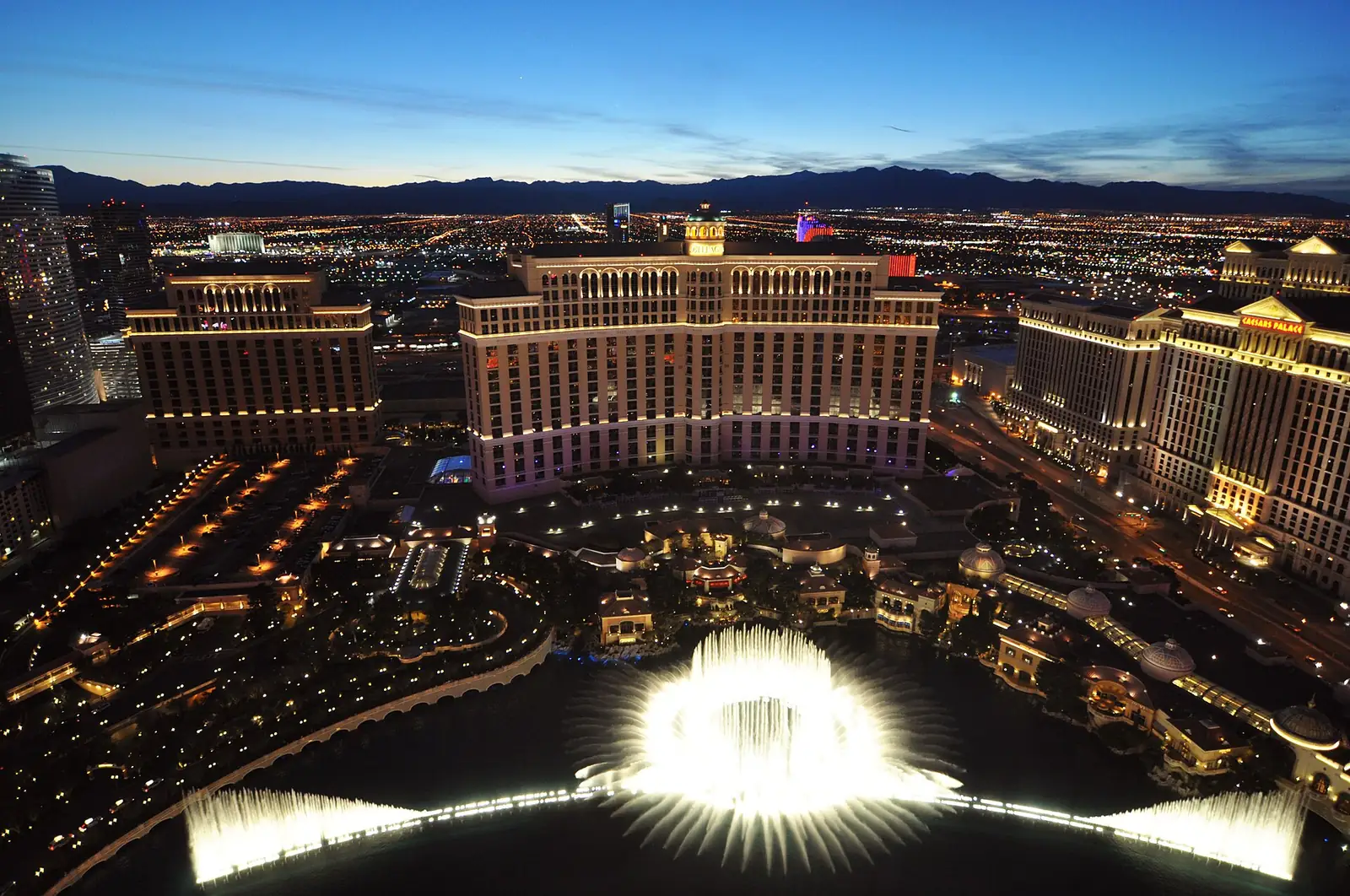 The Bellagio fountains and Las Vegas Strip at night.