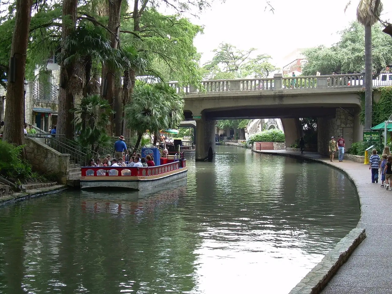 The San Antonio River Walk with paths and restaurants along the water.